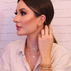 Piercing torcido banhado a ouro 18k