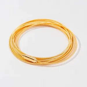 Pulseira corda de violão banhada a ouro 18k