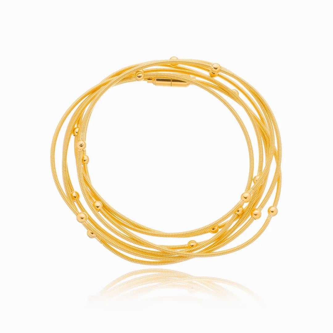 Pulseira corda de violão com bolinhas banhada a ouro 18k